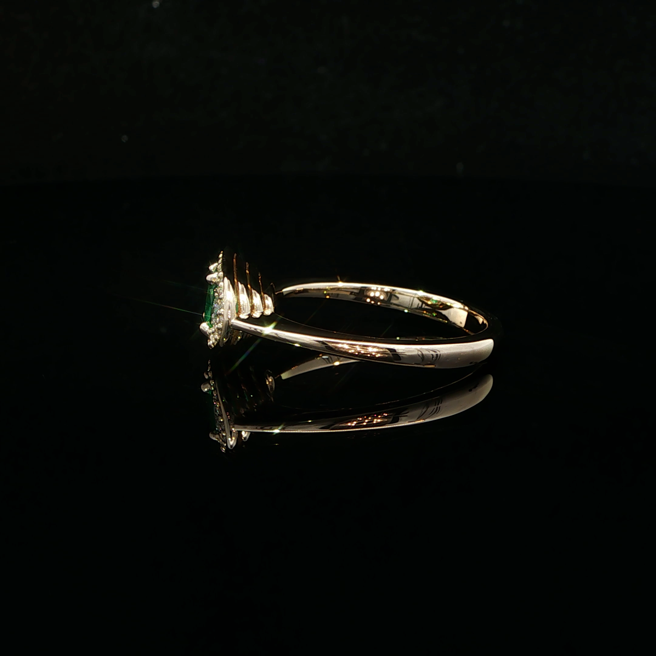 CUSHION EMERALD AND DIAMOND RING
